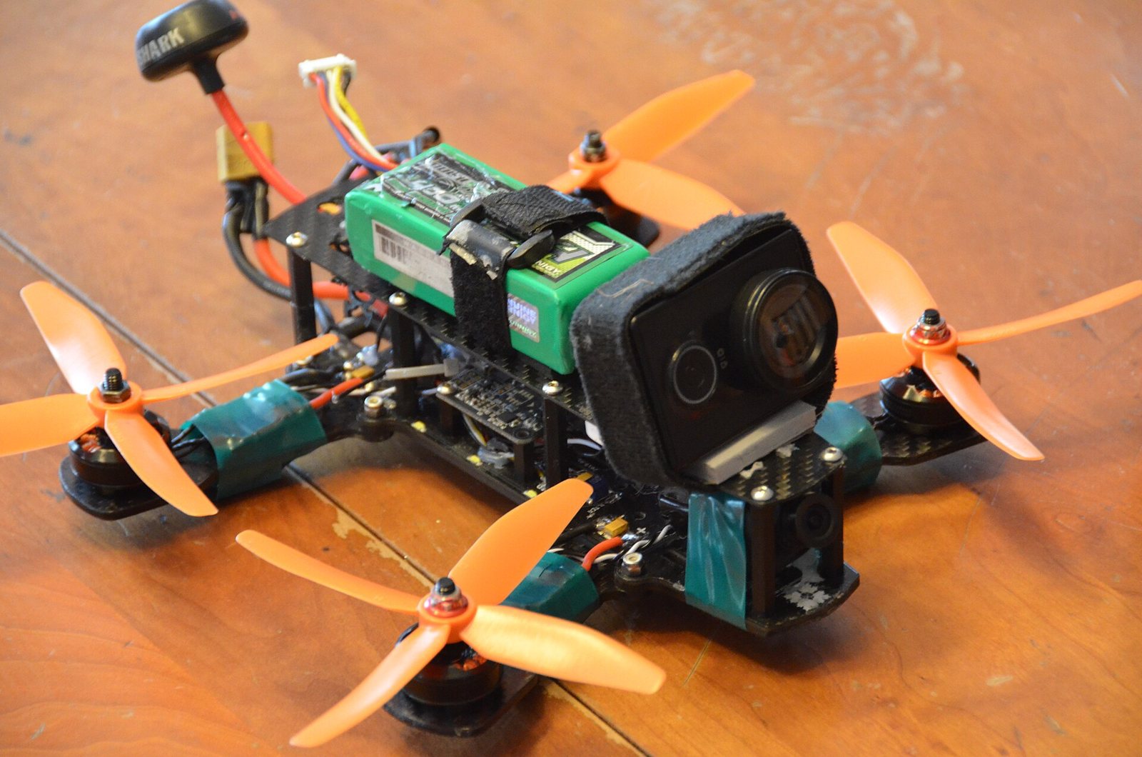 FPV racing drone on a wooden surface